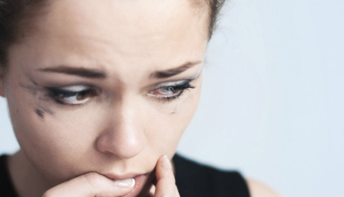 The upset woman bites one's nails